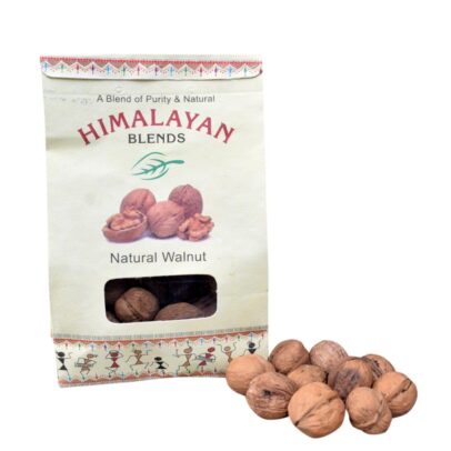 Organic Himalayan Walnuts in shell on a wooden table Close-up of handpicked organic walnuts from Himachal Pradesh Natural, sun-dried walnuts from Himalayan Blends Chamba Healthy organic walnuts in a rustic bowl – chemical-free and fresh
